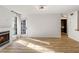 Spacious living room featuring hardwood floors, fireplace and patio access at 404 Granville Ct, Atlanta, GA 30328