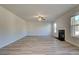 Living room with ceiling fan, fireplace and neutral paint at 108 Dalston Cv, Stockbridge, GA 30281