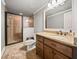 Basement bathroom with shower, granite vanity, and tile flooring at 121 Harmony Oaks Trl, Canton, GA 30115