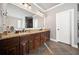 Large bathroom with double vanity, granite countertop, and a frameless shower at 121 Harmony Oaks Trl, Canton, GA 30115