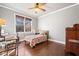 Bright bedroom with hardwood floors and a comfortable bed at 121 Harmony Oaks Trl, Canton, GA 30115