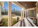 Front porch view of a wooded area, showcasing a relaxing atmosphere at 121 Harmony Oaks Trl, Canton, GA 30115