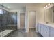 Elegant bathroom with double vanity, large shower, and walk-in closet at 205 Chiswick Loop, Stockbridge, GA 30281