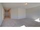 Bright hallway with carpeted floors leading to bedrooms at 205 Chiswick Loop, Stockbridge, GA 30281