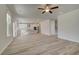 Open concept living room with kitchen view and hardwood floors at 205 Chiswick Loop, Stockbridge, GA 30281