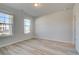 Home office with light gray walls, vinyl flooring, and large windows at 205 Chiswick Loop, Stockbridge, GA 30281