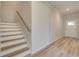 Stairway with white risers and wood treads leading to the second floor at 205 Chiswick Loop, Stockbridge, GA 30281