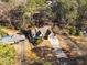 Aerial view of house and driveway, surrounded by trees at 5905 Kayron Dr, Atlanta, GA 30328