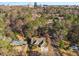 Aerial view of house and neighborhood with city skyline at 5905 Kayron Dr, Atlanta, GA 30328