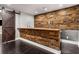 Basement bar with reclaimed wood and metal accents at 5905 Kayron Dr, Atlanta, GA 30328