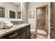 Bathroom with granite vanity, a shower, and dark brown cabinets at 5905 Kayron Dr, Atlanta, GA 30328