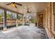 Spacious covered patio with stone flooring and ceiling fans at 5905 Kayron Dr, Atlanta, GA 30328