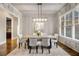 Formal dining room with hardwood floors and a modern chandelier at 5905 Kayron Dr, Atlanta, GA 30328