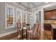 Dining area features a glass top table with four chairs at 5905 Kayron Dr, Atlanta, GA 30328