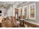 Bright dining room with glass table, four chairs, and hardwood floors at 5905 Kayron Dr, Atlanta, GA 30328