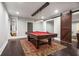 Basement game room with pool table and barn door at 5905 Kayron Dr, Atlanta, GA 30328