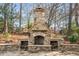 Elegant outdoor stone fireplace at 5905 Kayron Dr, Atlanta, GA 30328