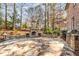 Stone patio with outdoor fireplace and grill at 5905 Kayron Dr, Atlanta, GA 30328