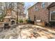 Outdoor kitchen and fireplace with flagstone patio at 5905 Kayron Dr, Atlanta, GA 30328