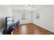 Bright bedroom with hardwood floors, a window, and workspace at 2450 Prince Howard Trl, Marietta, GA 30062