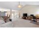 Living room with vaulted ceiling, fireplace and plenty of natural light at 981 Golden Meadows Ln, Loganville, GA 30052