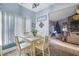 Breakfast nook with white table and chairs, view of living room at 110 Wiley Bridge Ct, Woodstock, GA 30188