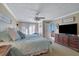 Large main bedroom with ceiling fan, lots of natural light and en-suite bathroom at 110 Wiley Bridge Ct, Woodstock, GA 30188