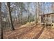 Wooded backyard with sloped terrain at 1482 Kings Ridge Dr, Norcross, GA 30093