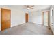 Large bedroom with ceiling fan and access to bathroom at 1482 Kings Ridge Dr, Norcross, GA 30093