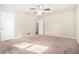 Bright bedroom with neutral carpeting and ceiling fan at 2591 Connally Dr, Atlanta, GA 30344