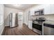 Updated kitchen with stainless steel appliances and granite counters at 2591 Connally Dr, Atlanta, GA 30344