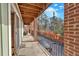 Covered balcony with brick columns and a view of the surrounding area at 1705 Monroe Ne Dr # B05, Atlanta, GA 30324