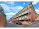 Brick building exterior with multiple balconies and parking at 1705 Monroe Ne Dr # B05, Atlanta, GA 30324