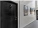 Simple apartment hallway with framed art and carpeted floors at 1705 Monroe Ne Dr # B05, Atlanta, GA 30324