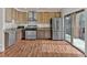 Modern kitchen with stainless steel appliances and wood cabinets at 1705 Monroe Ne Dr # B05, Atlanta, GA 30324