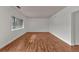 Bright living room featuring hardwood floors and large window at 1705 Monroe Ne Dr # B05, Atlanta, GA 30324