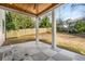 Covered back porch with checkered tile floor and wooden ceiling at 2675 S Bamby Ne Ln, Brookhaven, GA 30319