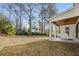 View of backyard with covered porch and trees at 2675 S Bamby Ne Ln, Brookhaven, GA 30319