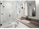 Stylish bathroom with wood vanity and frameless shower at 2675 S Bamby Ne Ln, Brookhaven, GA 30319