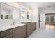 Elegant bathroom with double vanity, marble countertops, and herringbone tile floor at 2675 S Bamby Ne Ln, Brookhaven, GA 30319