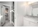 Modern bathroom with white vanity, a glass shower, and grey tile flooring at 2675 S Bamby Ne Ln, Brookhaven, GA 30319