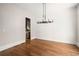 Spacious dining room featuring hardwood floors and a stylish chandelier at 2675 S Bamby Ne Ln, Brookhaven, GA 30319