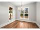 Bright dining room with hardwood floors and large windows at 2675 S Bamby Ne Ln, Brookhaven, GA 30319