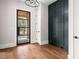 Light and airy entryway featuring a modern black framed door and dark wall accents at 2675 S Bamby Ne Ln, Brookhaven, GA 30319