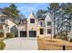 Stunning two-story home with a charming front elevation, three-car garage, and landscaped yard at 2675 S Bamby Ne Ln, Brookhaven, GA 30319