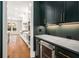 Modern kitchen with dark cabinetry, stainless steel appliances, and quartz countertops at 2675 S Bamby Ne Ln, Brookhaven, GA 30319