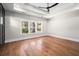 Main bedroom with hardwood floors and a large window at 2675 S Bamby Ne Ln, Brookhaven, GA 30319