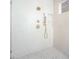 Spa-like shower with marble tile, rainfall shower head, and built-in shelving at 2675 S Bamby Ne Ln, Brookhaven, GA 30319