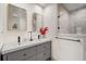 Double vanity bathroom with gray cabinets and gold mirrors at 3047 Lenox Ne Rd # 1108, Atlanta, GA 30324