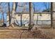 House backyard with mature trees and a fence at 409 Katherine Ln, Woodstock, GA 30189